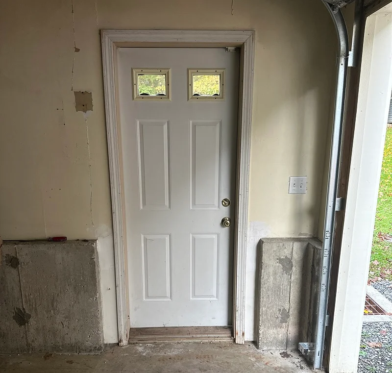 Steel basement door is rusting